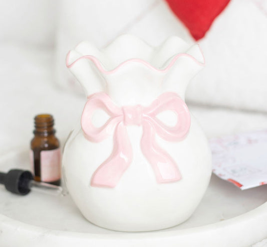 White and pink bow burner